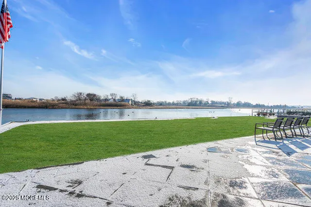 a view of a lake with a big yard