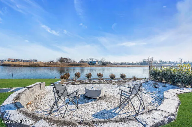 a terrace with outdoor seating and city view