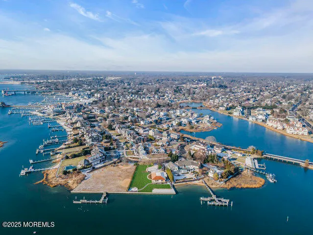 an aerial view of a house with a swimming pool yard and outdoor seating