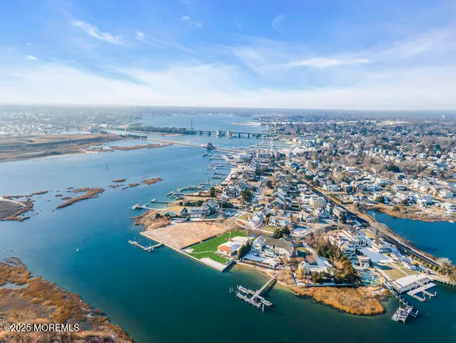 an aerial view of a house with a lake view