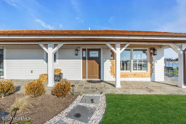 a view of house with porch