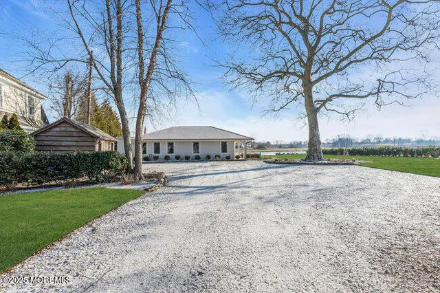 a view of outdoor space with garden and trees