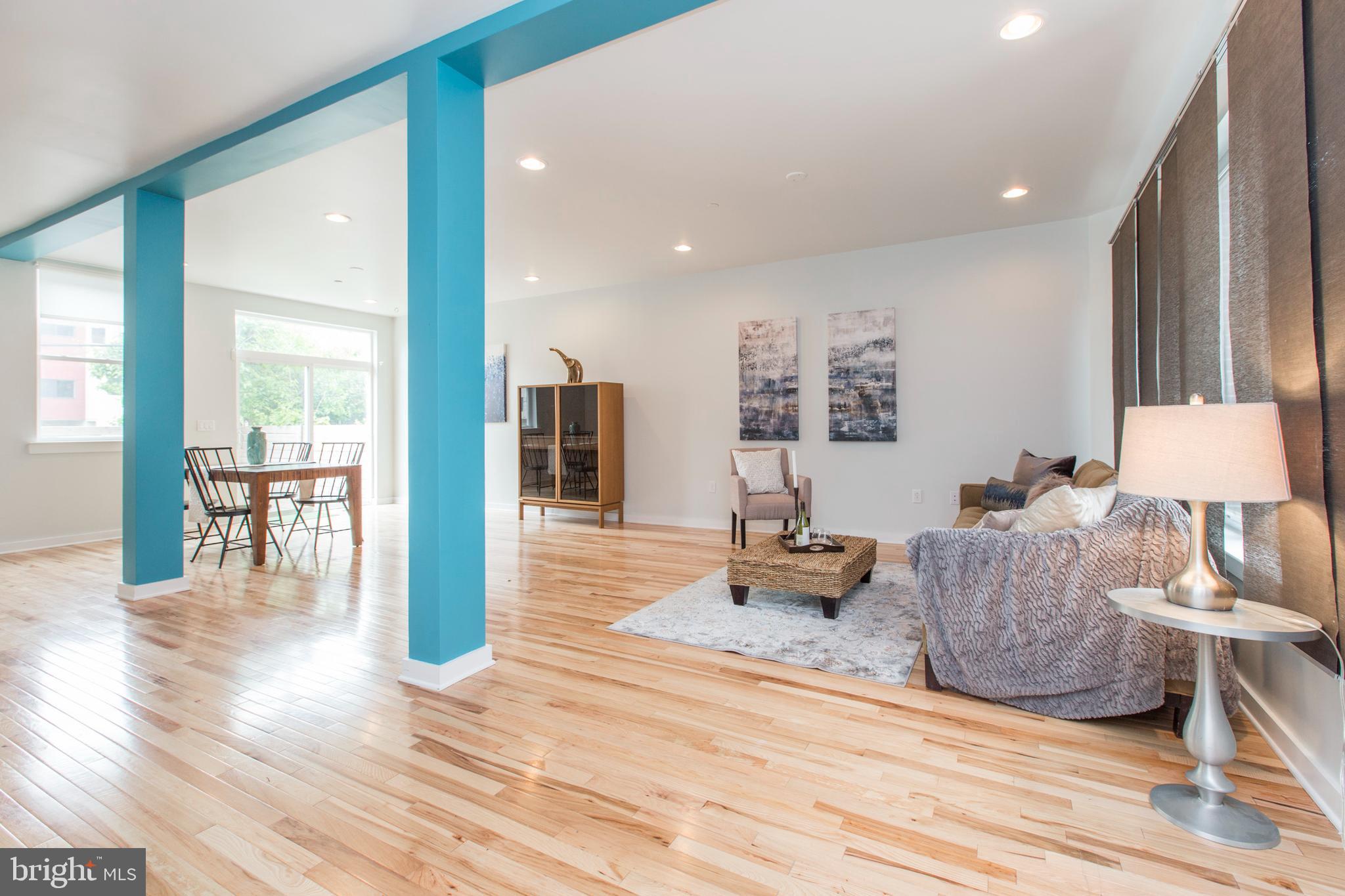 3039-41 Baltz Street Philadelphia, PA 19121 - Photo 13 of 35 a living room with furniture and a wooden floor