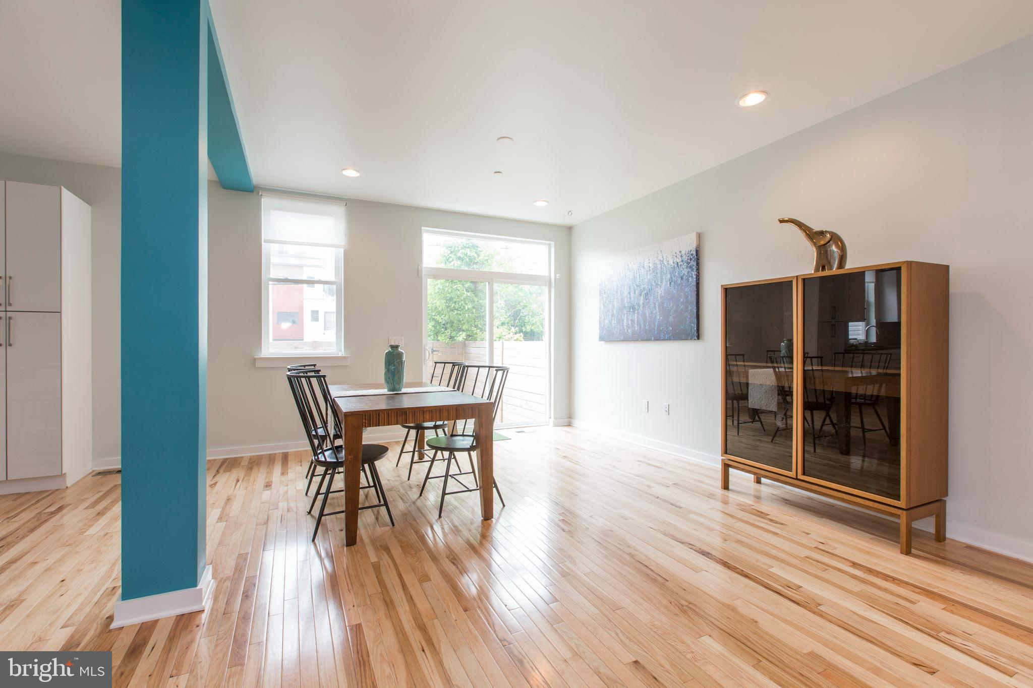 3039-41 Baltz Street Philadelphia, PA 19121 - Photo 17 of 35 a view of a dining room with furniture and wooden floor