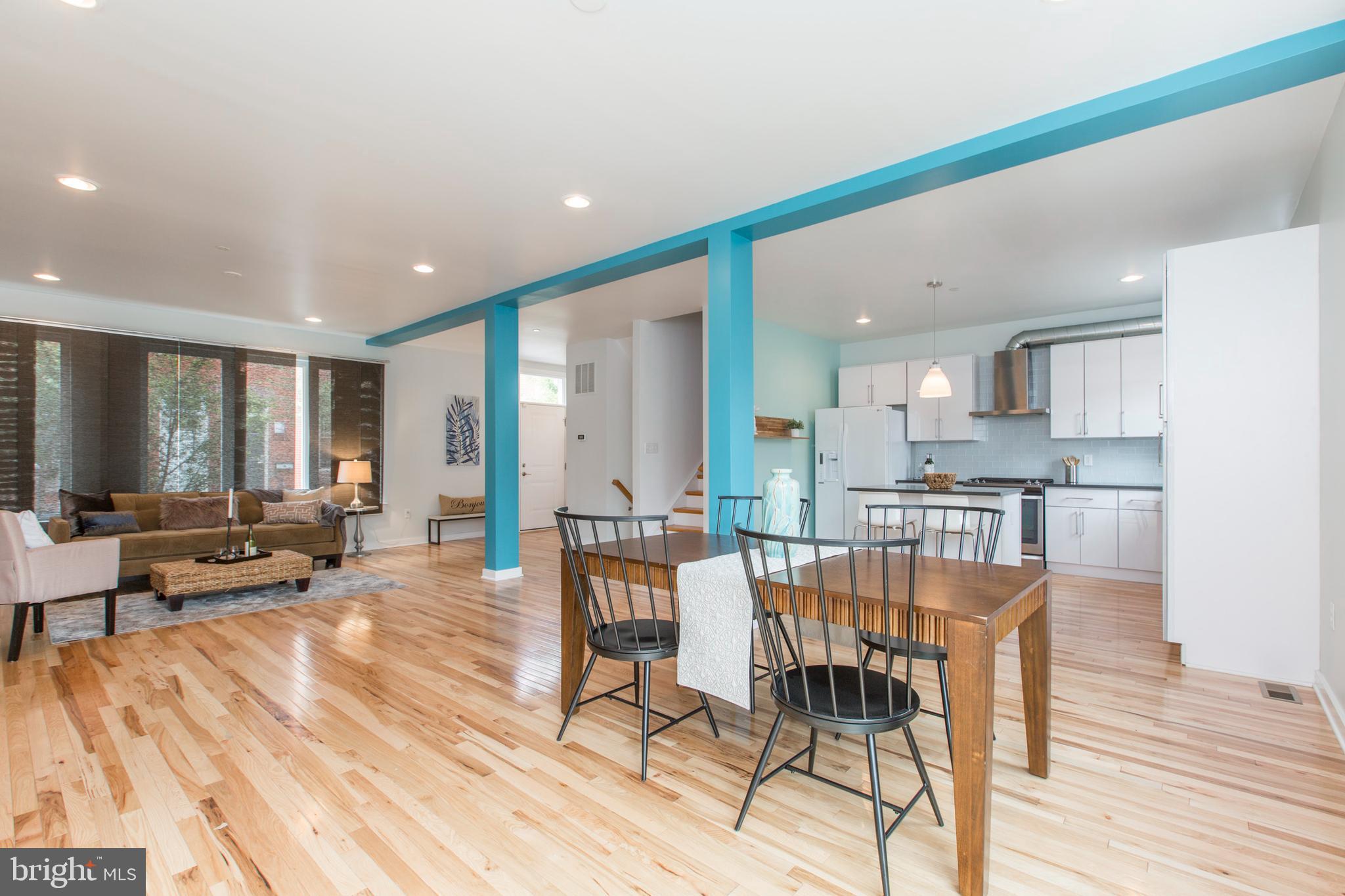 3039-41 Baltz Street Philadelphia, PA 19121 - Photo 3 of 35 a view of a dining room with furniture window and wooden floor