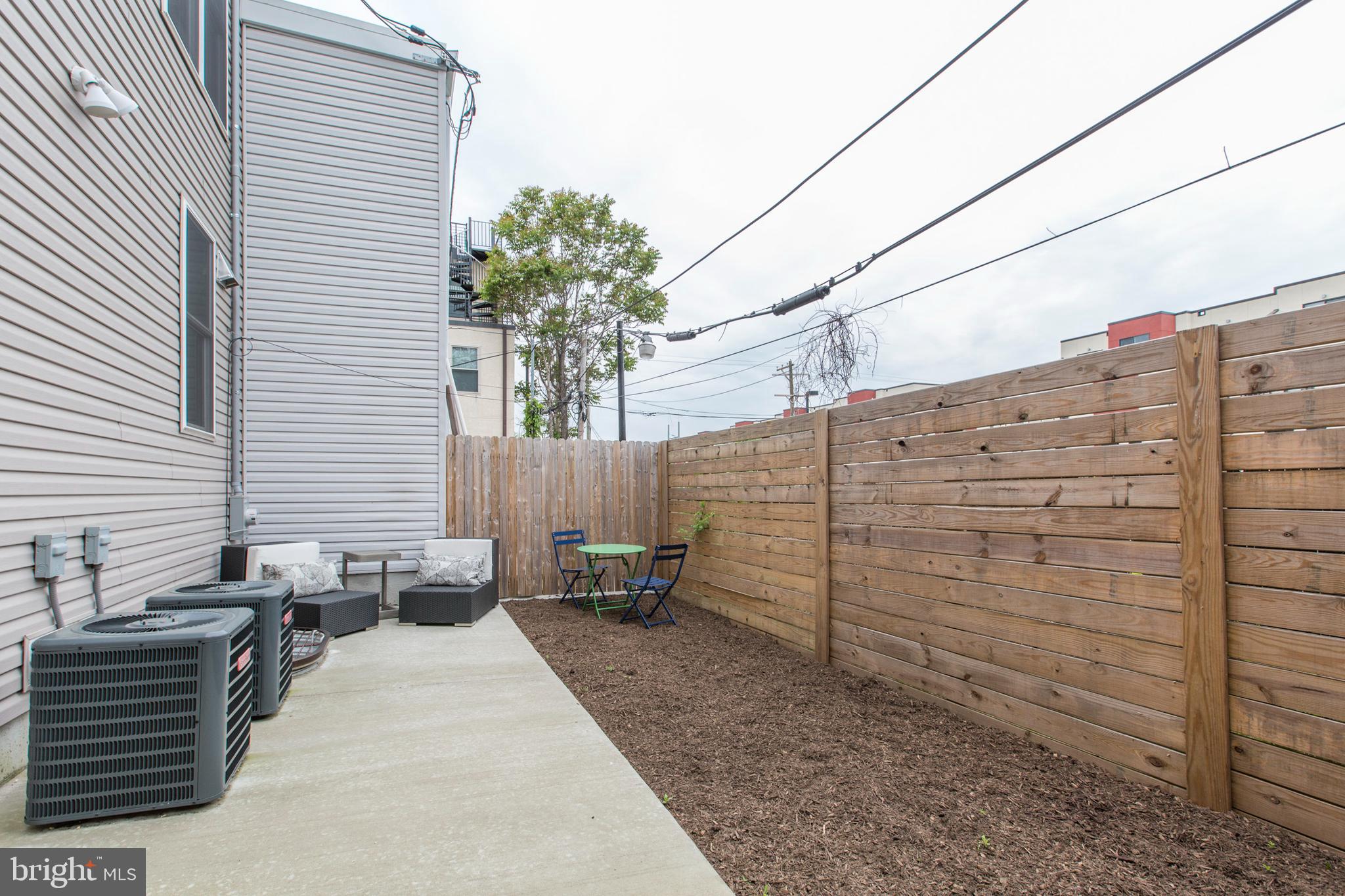 3039-41 Baltz Street Philadelphia, PA 19121 - Photo 31 of 35 a backyard of a house