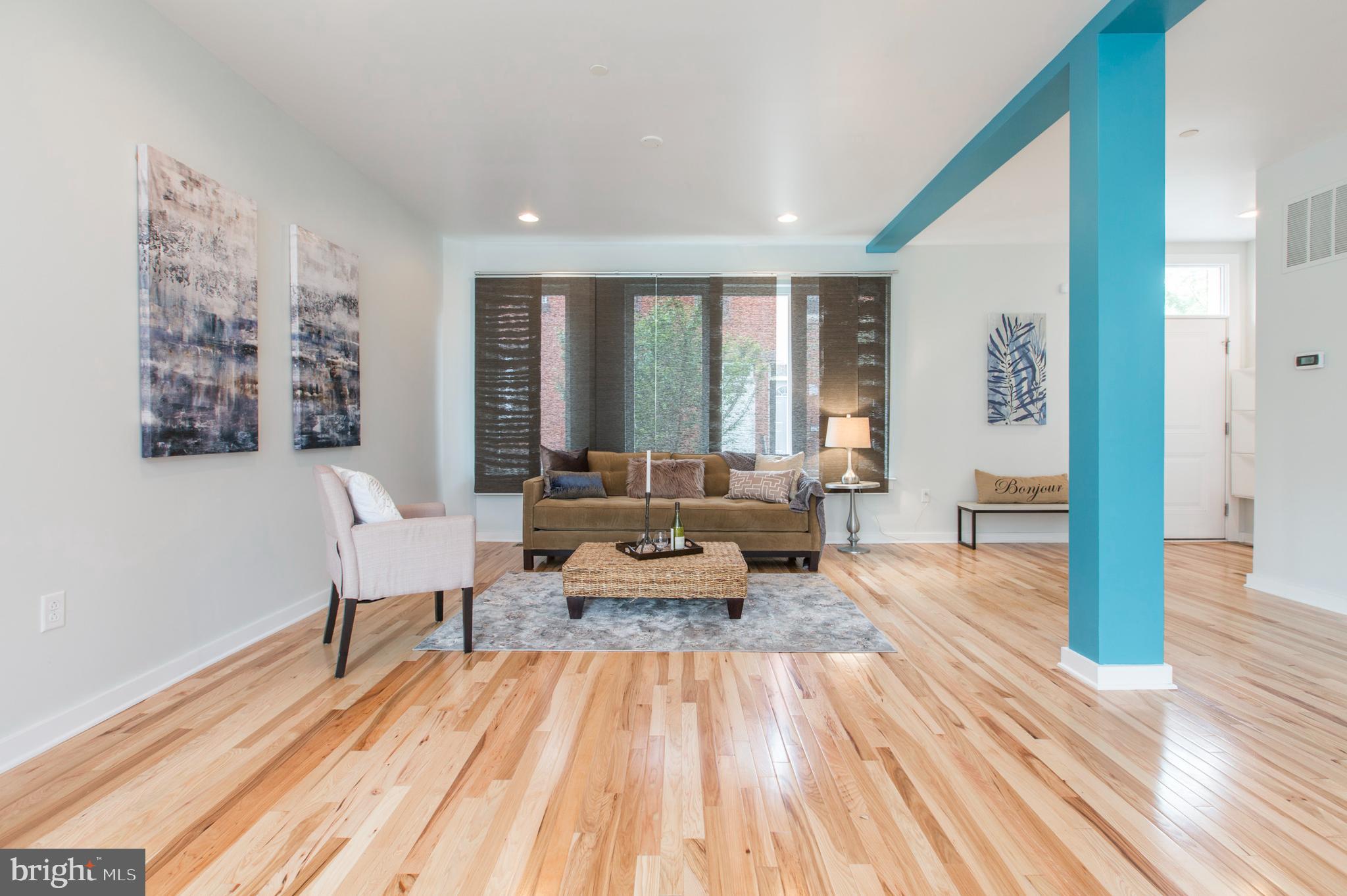 3039-41 Baltz Street Philadelphia, PA 19121 - Photo 4 of 35 a living room with furniture and a wooden floor