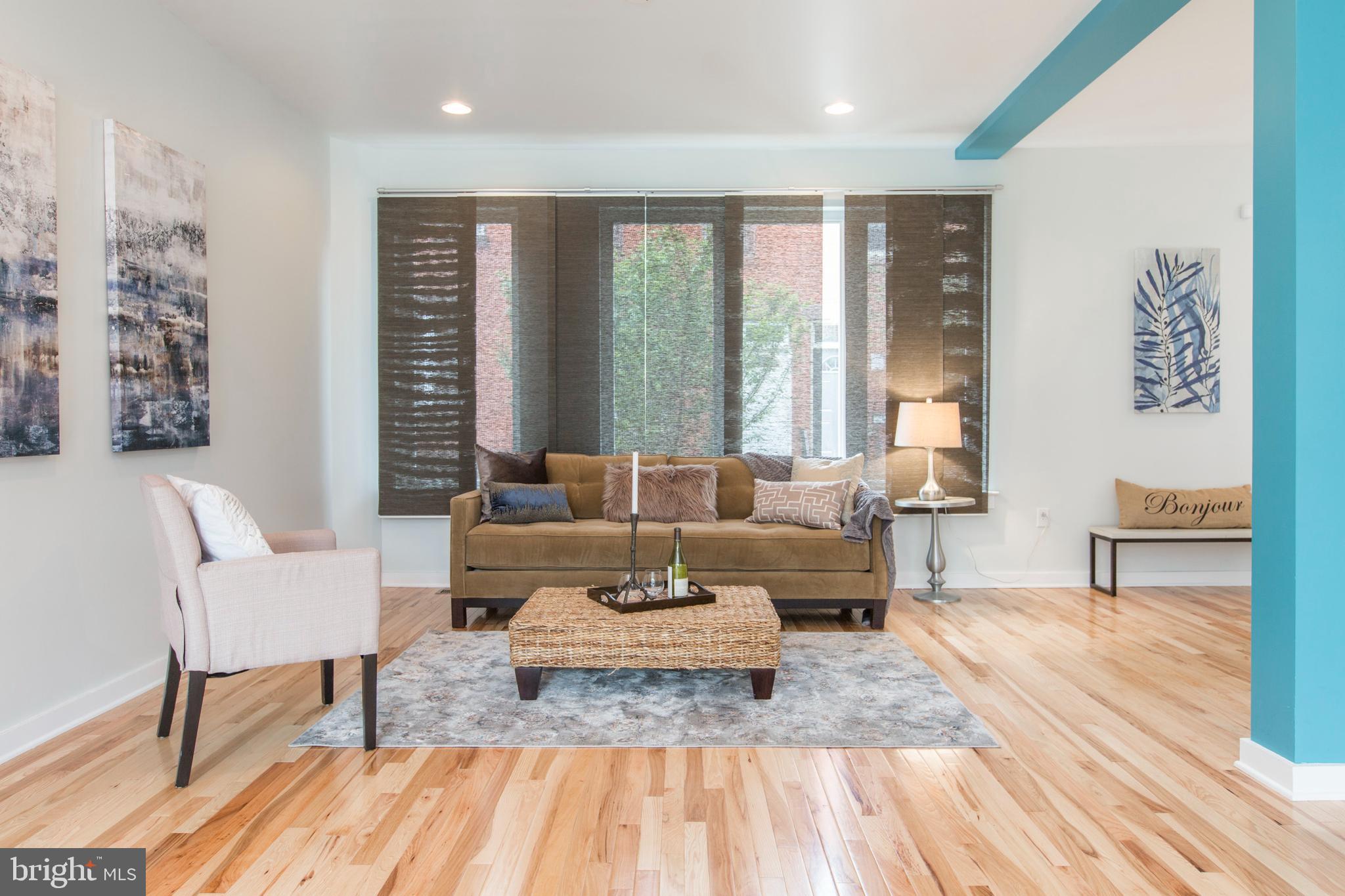 3039-41 Baltz Street Philadelphia, PA 19121 - Photo 10 of 35 a living room with furniture and a large window
