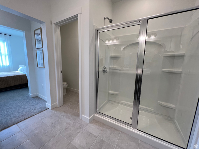 718 West Blue Magic Lane, Unit S201 Midvale, UT 84047 - Photo 12 of 18 Full bath with ensuite bath and a stall shower