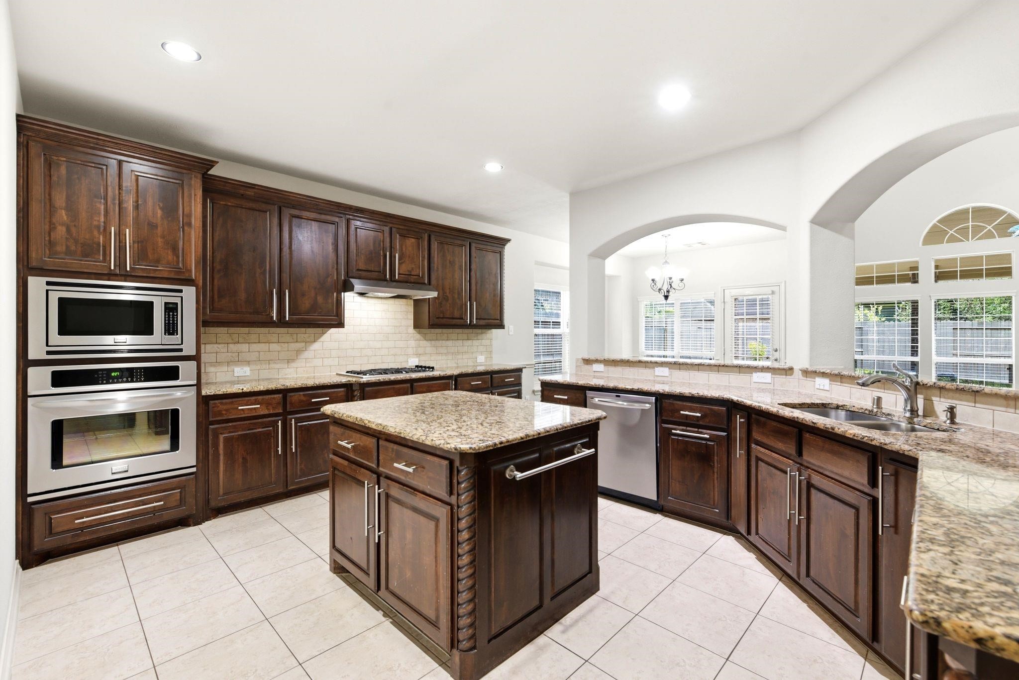 19903 Senterra Lakes Boulevard Spring, TX 77379 - Photo 14 of 50 Elegant kitchen offering a gas range and built in oven microwave.