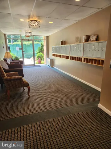 a view of a living room with a floor to ceiling window and floor