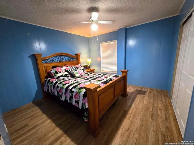 a bed sitting in a bedroom next to a window