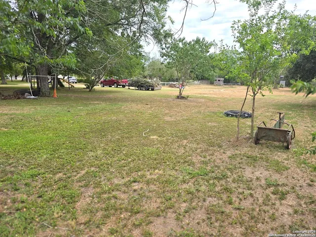 a backyard of a house with lots of green space