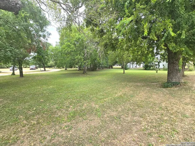 a view of outdoor space with deck and yard