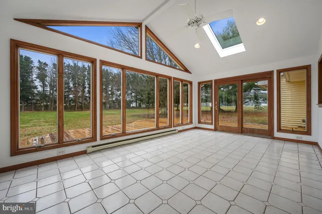 a view of an empty room with windows