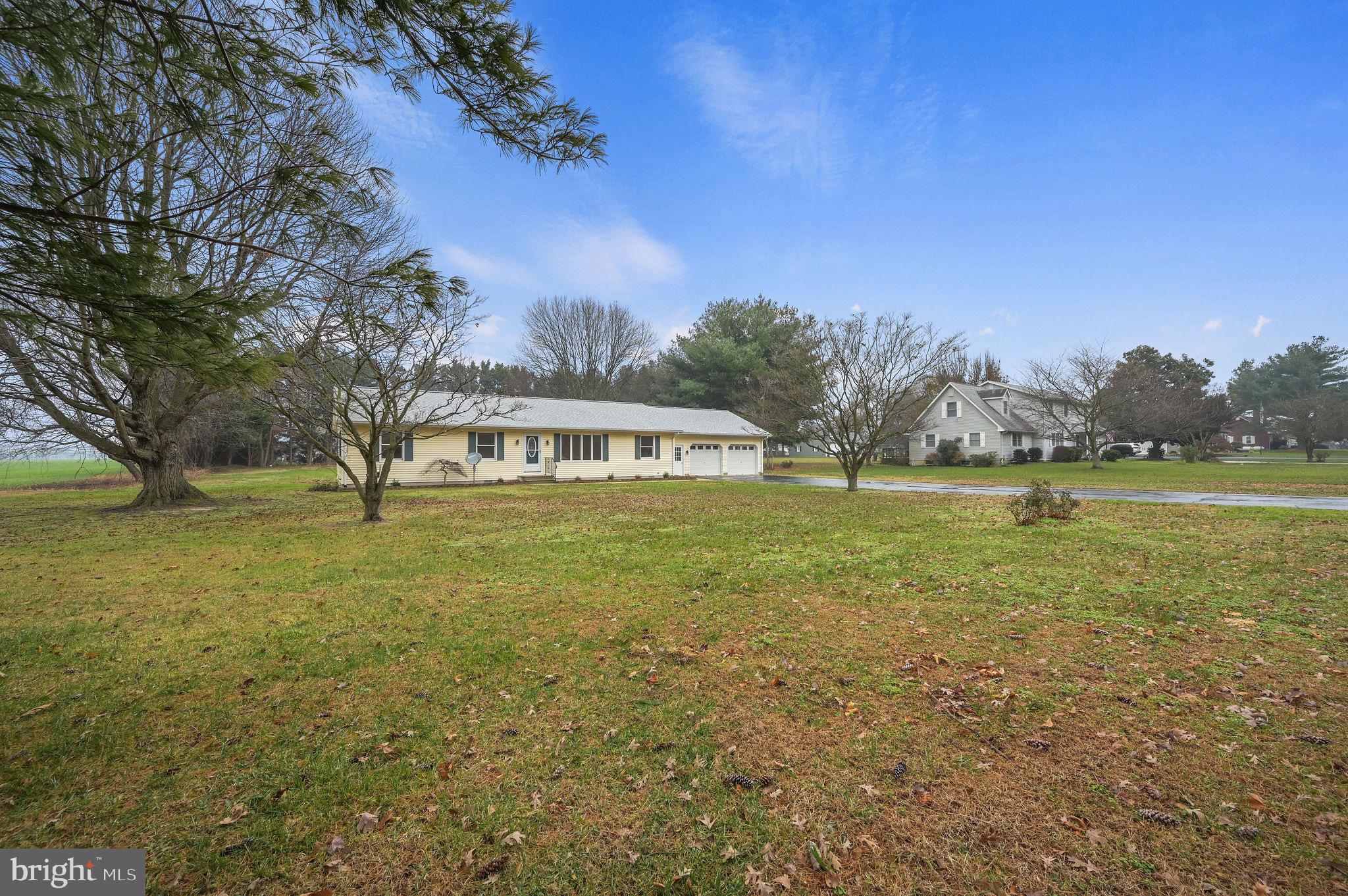 311 Sophers Row Magnolia, DE 19962 - Photo 2 of 40 a view of outdoor space with green field and trees