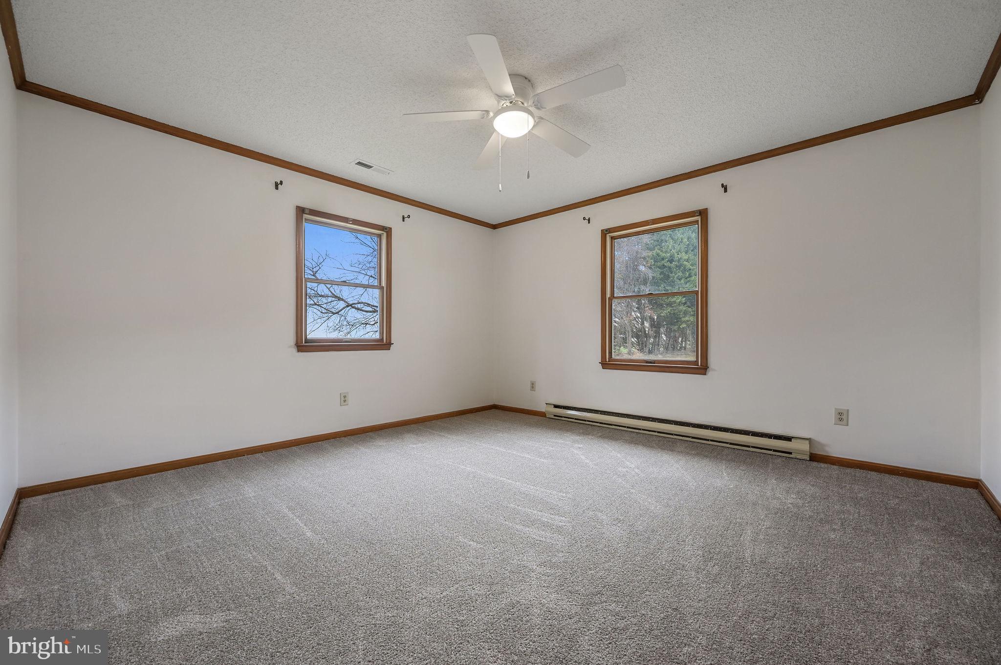 311 Sophers Row Magnolia, DE 19962 - Photo 25 of 40 an empty room with windows and ceiling fan