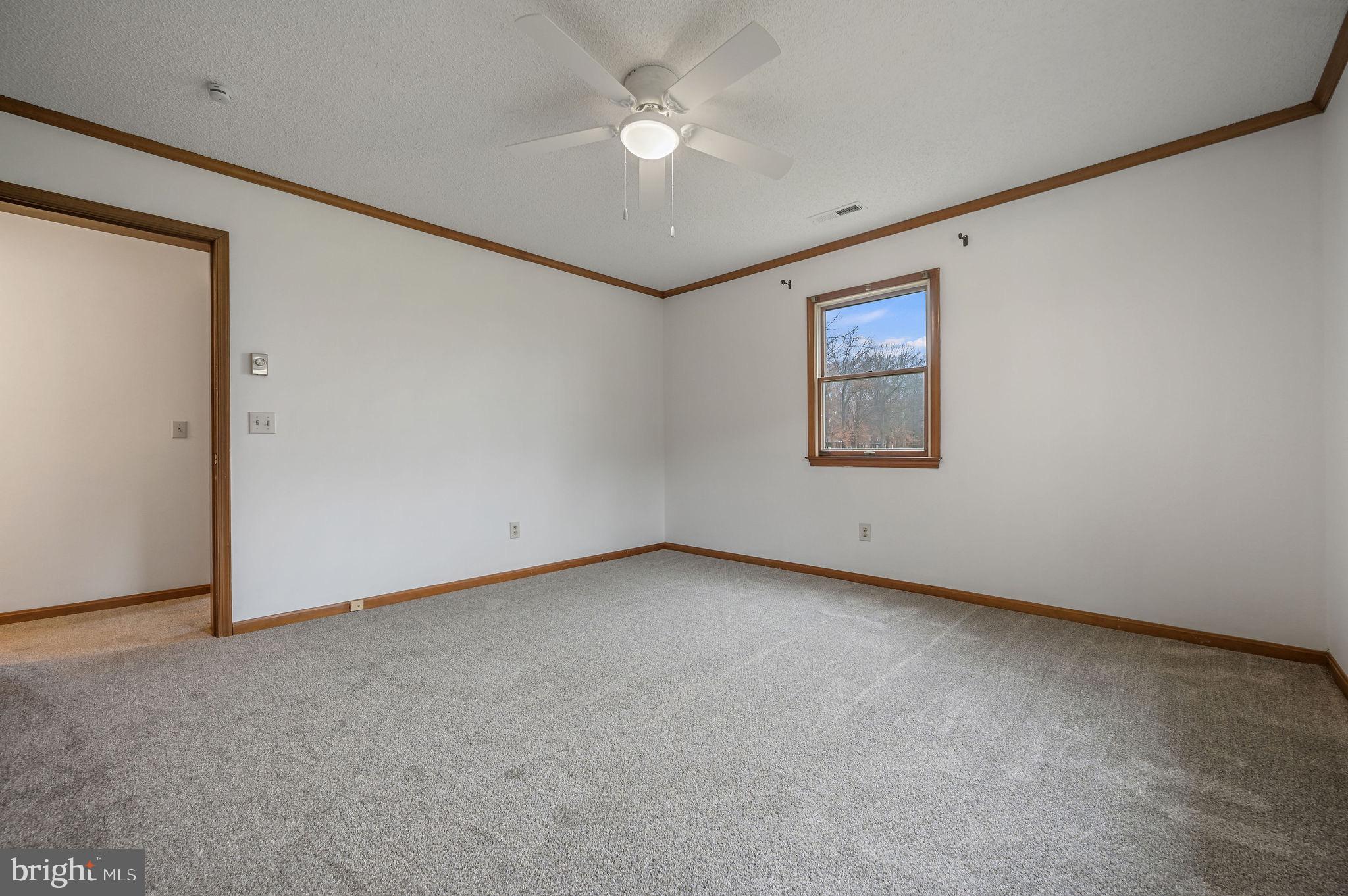 311 Sophers Row Magnolia, DE 19962 - Photo 26 of 40 an empty room with windows and fan