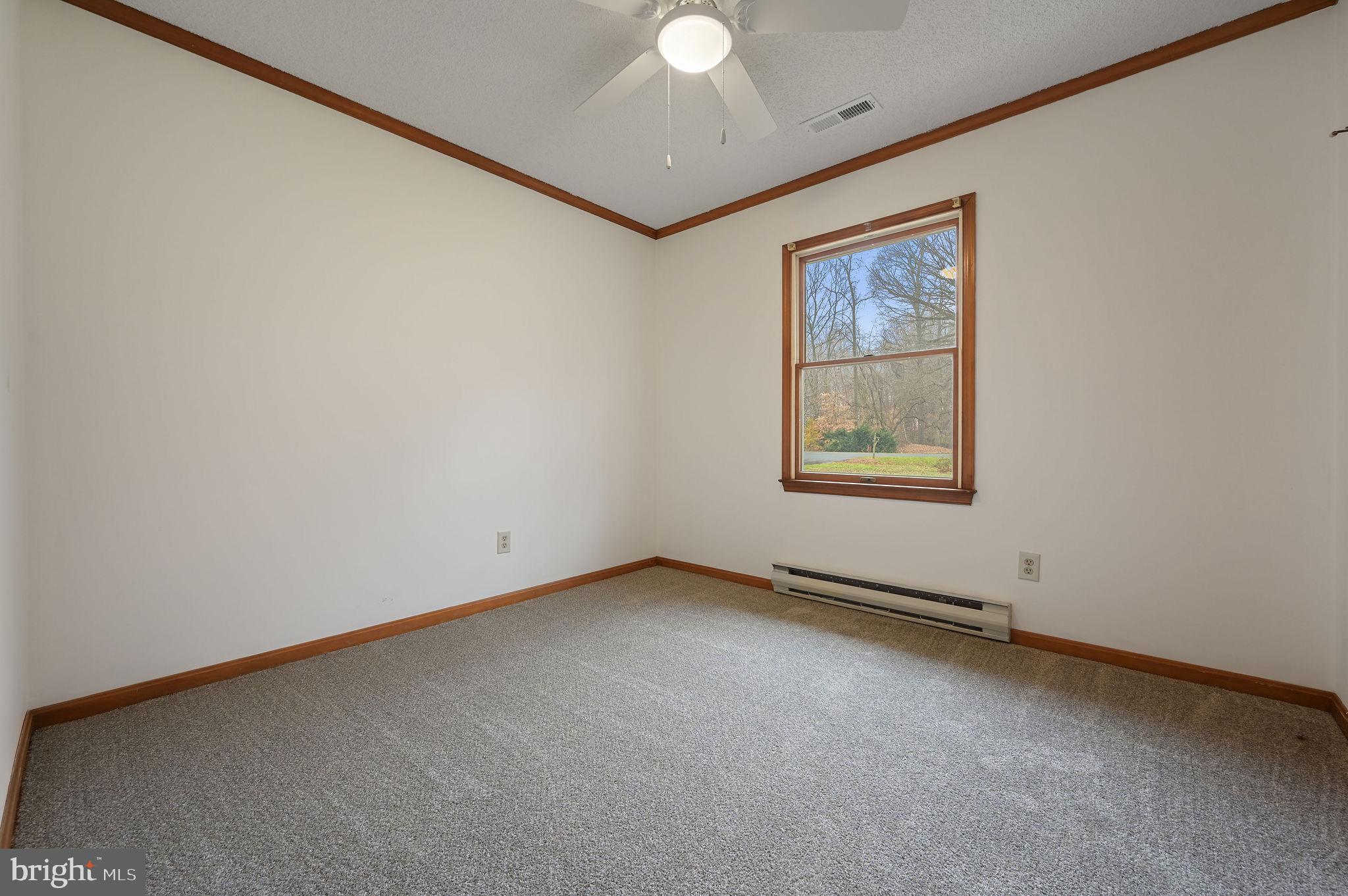 311 Sophers Row Magnolia, DE 19962 - Photo 31 of 40 an empty room with windows and fan