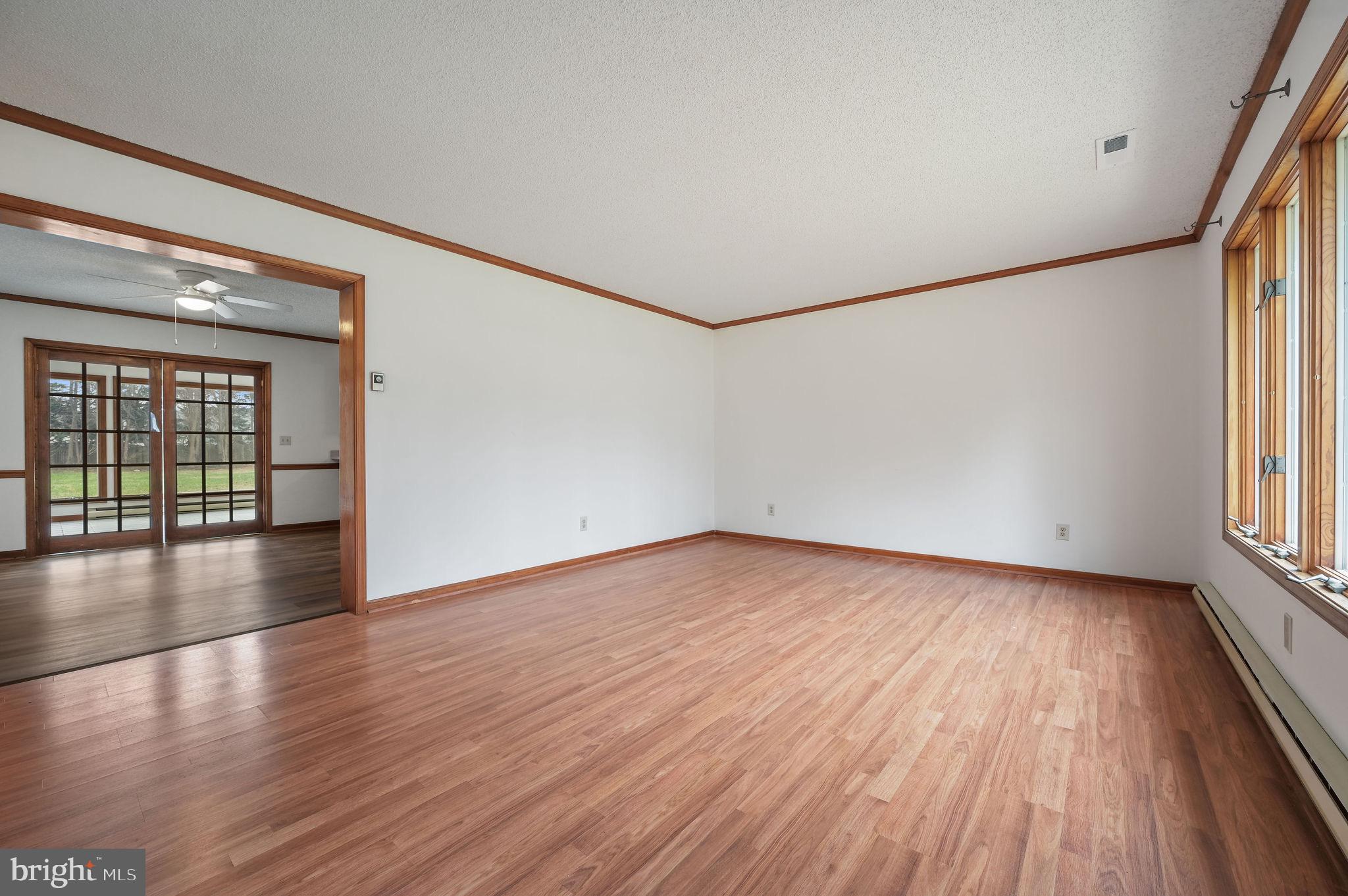 311 Sophers Row Magnolia, DE 19962 - Photo 4 of 40 wooden floor in an empty room with a window