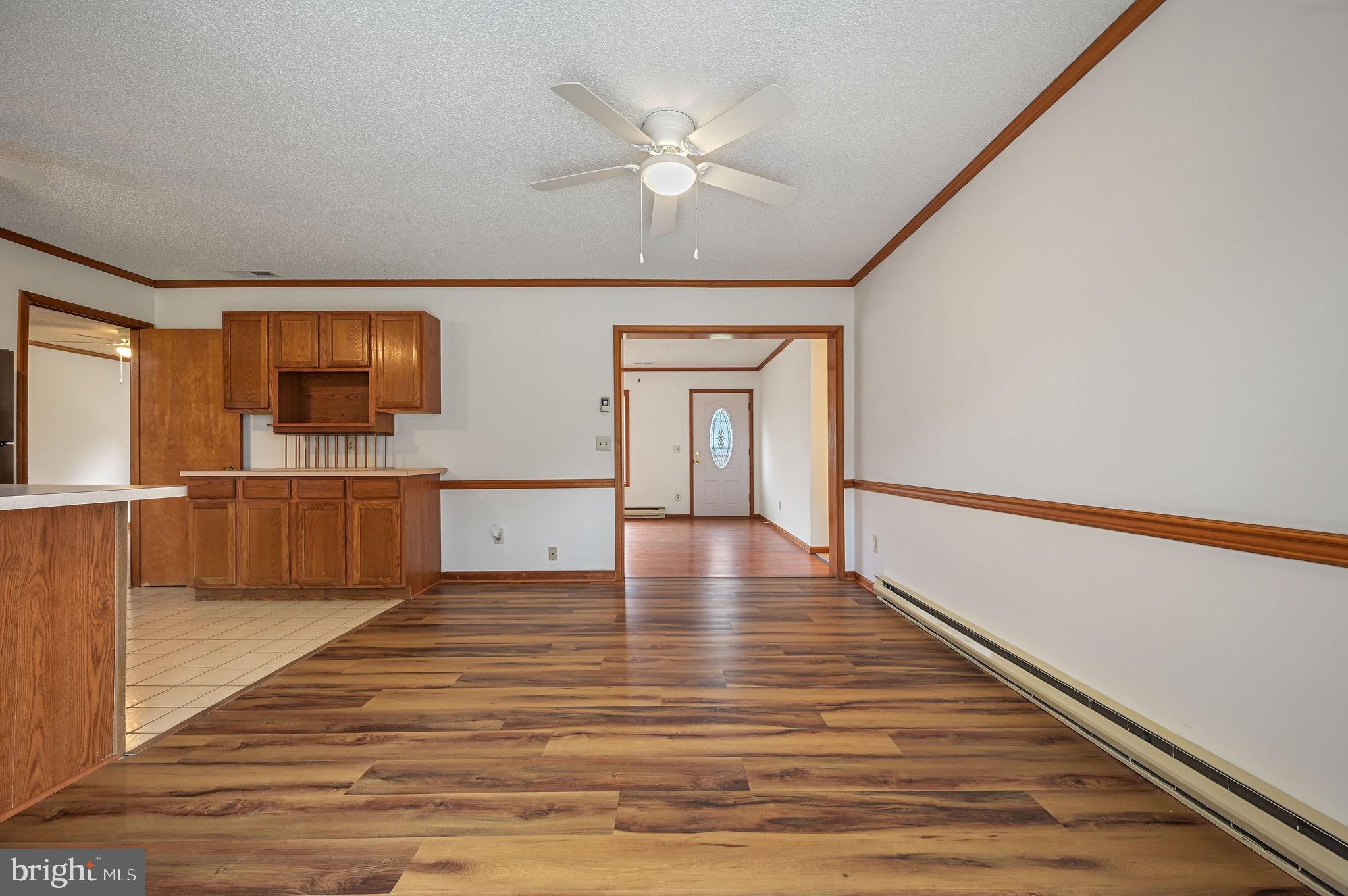 311 Sophers Row Magnolia, DE 19962 - Photo 10 of 40 a view of a livingroom with wooden floor and a ceiling fan