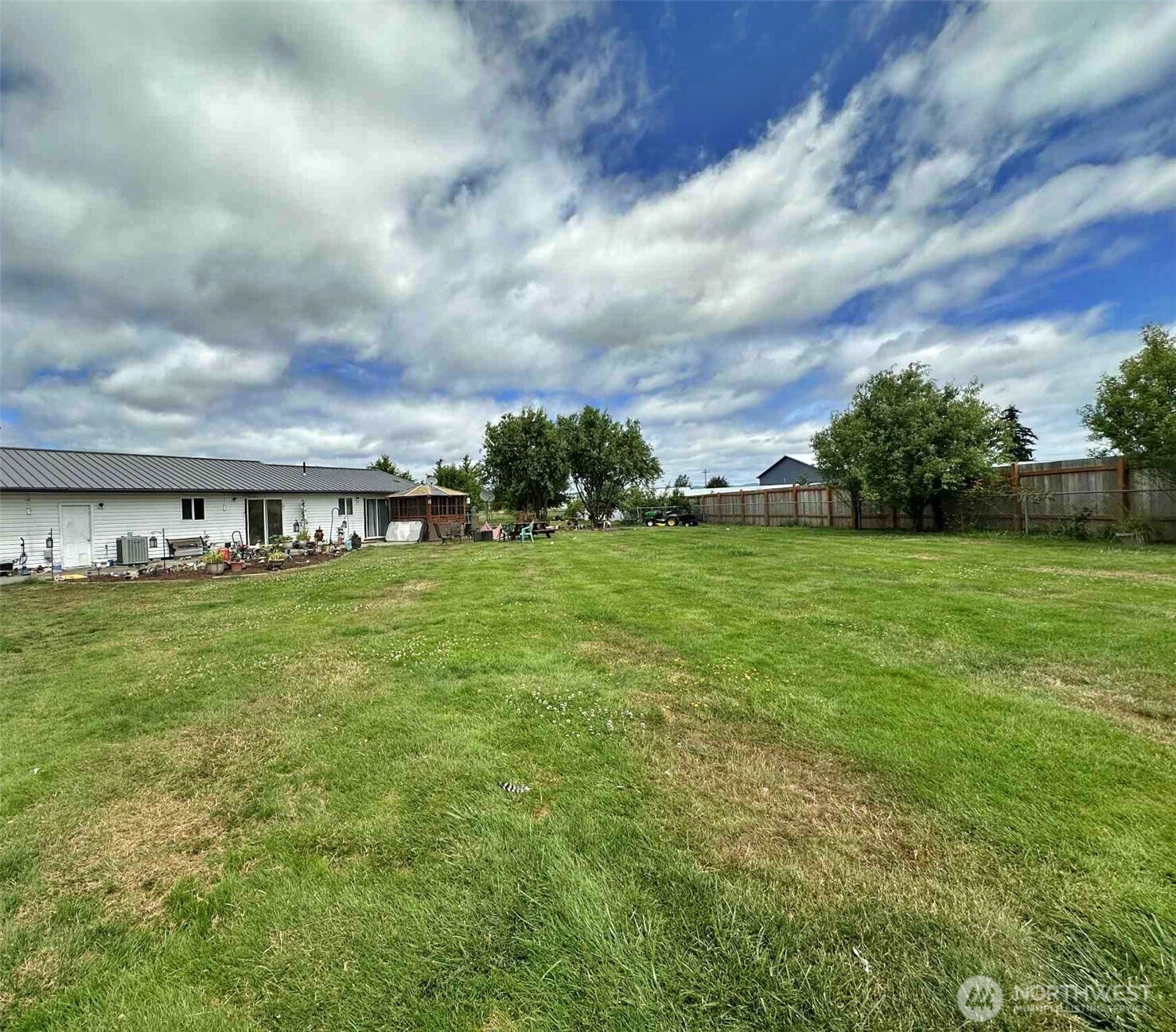 119 Brim Road Onalaska, WA 98570 - Photo 4 of 14 a view of a garden with a building in the background