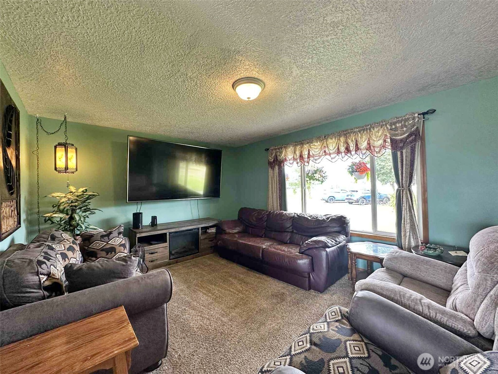 119 Brim Road Onalaska, WA 98570 - Photo 10 of 14 a living room with furniture and a flat screen tv