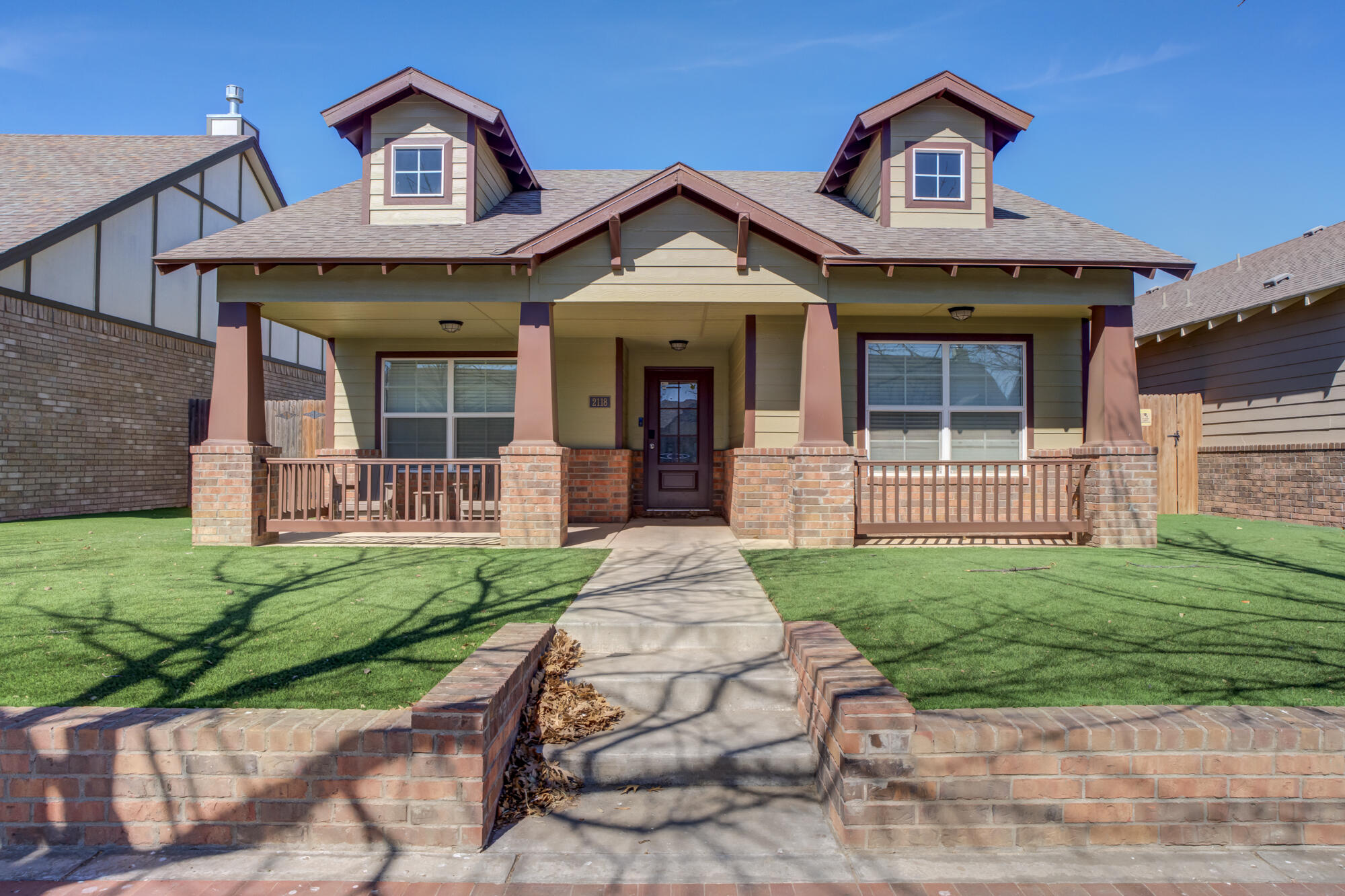 2118 9th Street Lubbock, TX 79401 - Photo 1 of 28 a front view of a house with garden