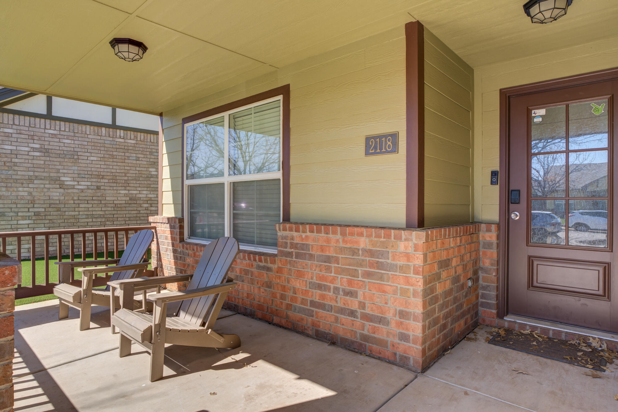 2118 9th Street Lubbock, TX 79401 - Photo 2 of 28 a bed room with a bed and two windows