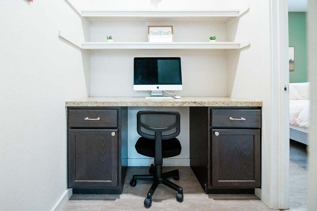 2118 9th Street Lubbock, TX 79401 - Photo 21 of 28 a view of a sink and chair in a room