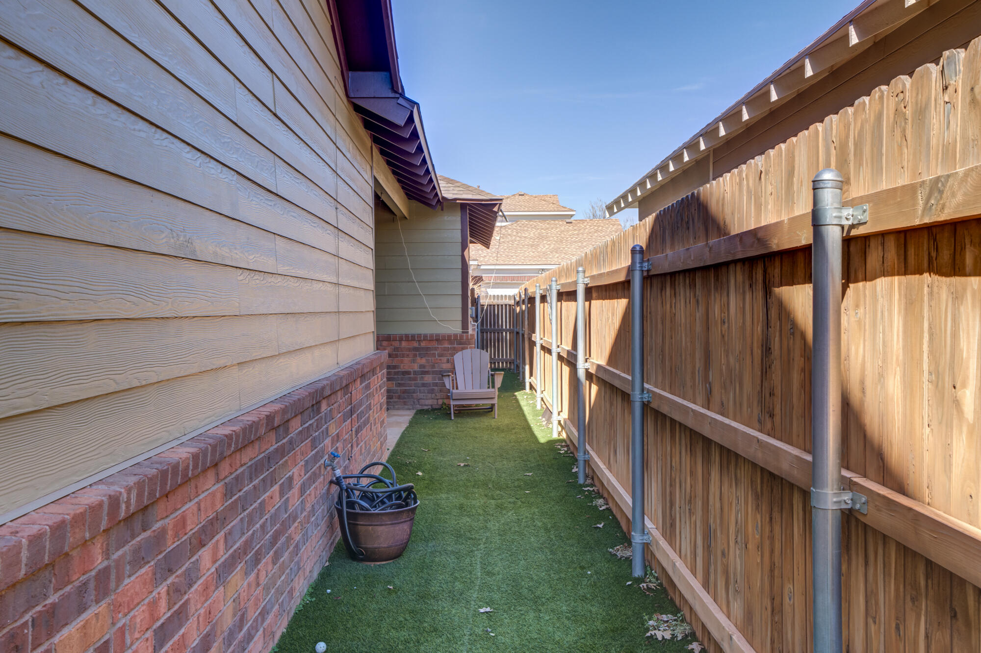 2118 9th Street Lubbock, TX 79401 - Photo 26 of 28 a view of a backyard with wooden fence