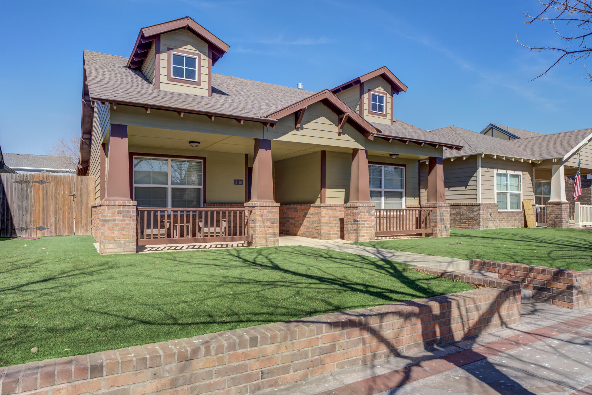 2118 9th Street Lubbock, TX 79401 - Photo 4 of 28 a front view of a house with garden