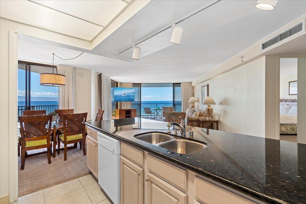 3445 Lower Honoapiilani Road, Unit 701 Lahaina, HI 96761 - Photo 14 of 40 a kitchen that has a sink and cabinets