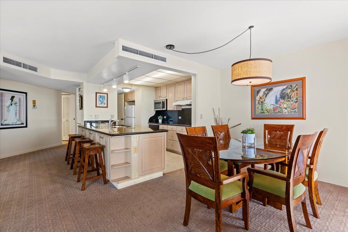 3445 Lower Honoapiilani Road, Unit 701 Lahaina, HI 96761 - Photo 15 of 40 a dining room with furniture and window