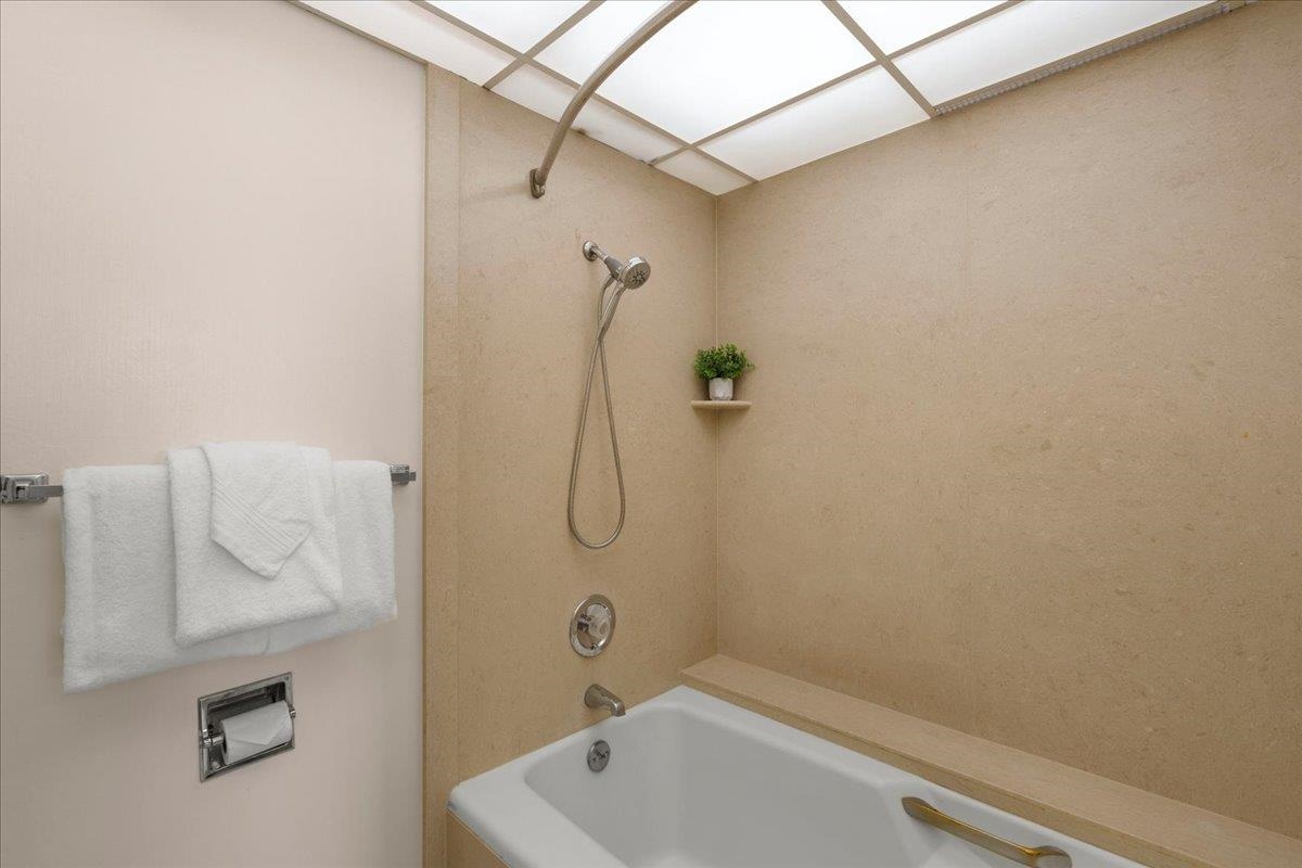 3445 Lower Honoapiilani Road, Unit 701 Lahaina, HI 96761 - Photo 29 of 40 a bathroom with a shower and a bathtub