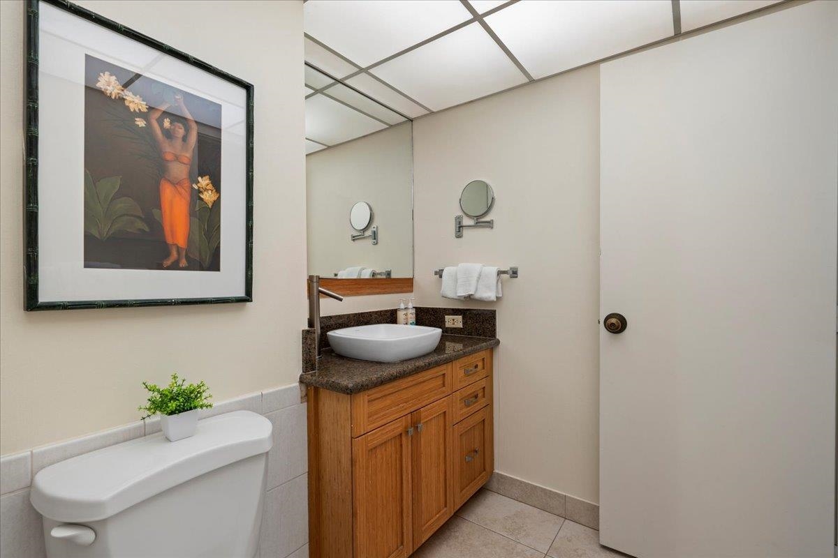3445 Lower Honoapiilani Road, Unit 701 Lahaina, HI 96761 - Photo 35 of 40 a kitchen with a sink and cabinets