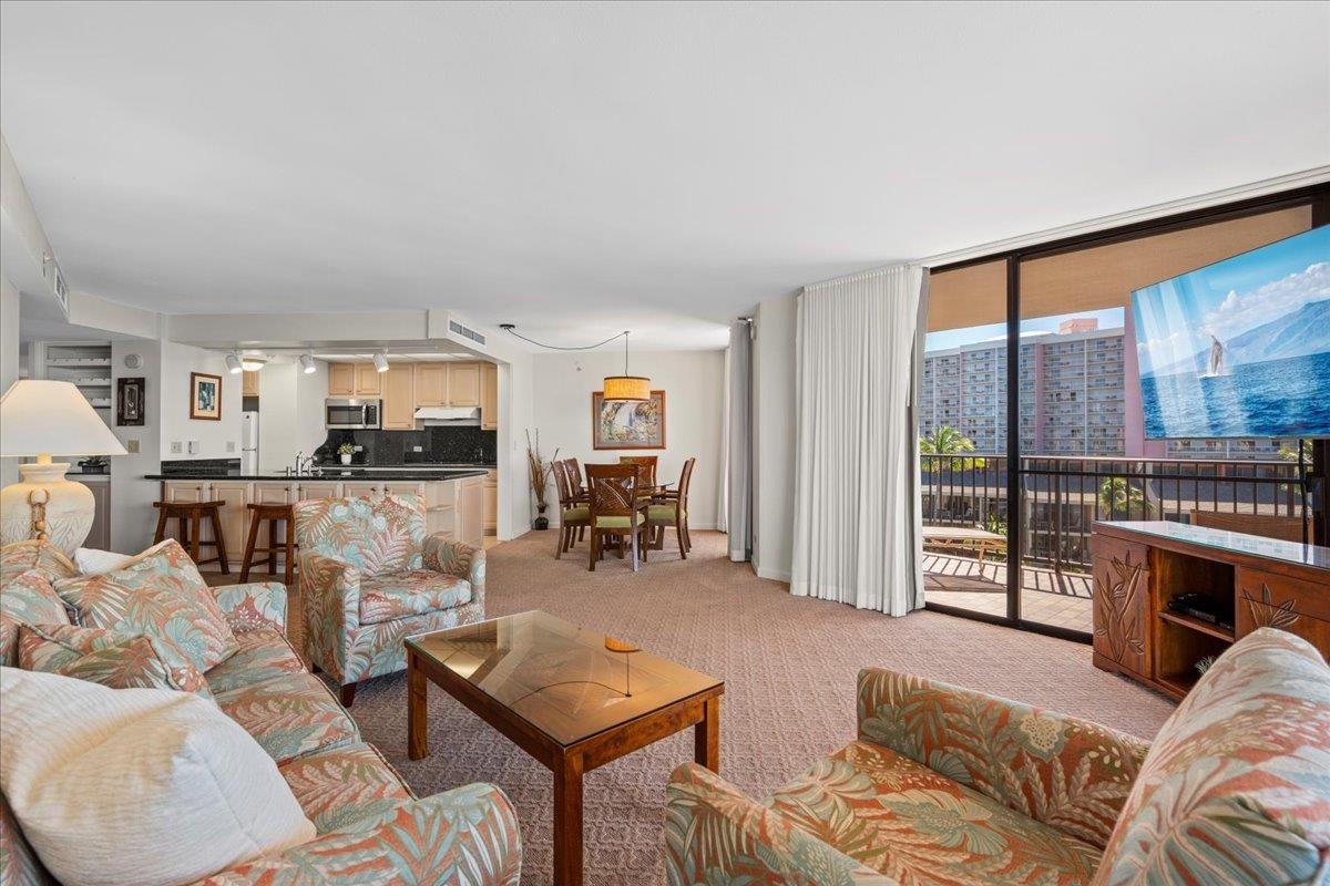 3445 Lower Honoapiilani Road, Unit 701 Lahaina, HI 96761 - Photo 8 of 40 a living room with furniture and a flat screen tv