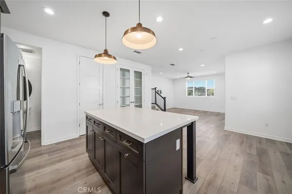 a kitchen that has a lot of cabinets in it