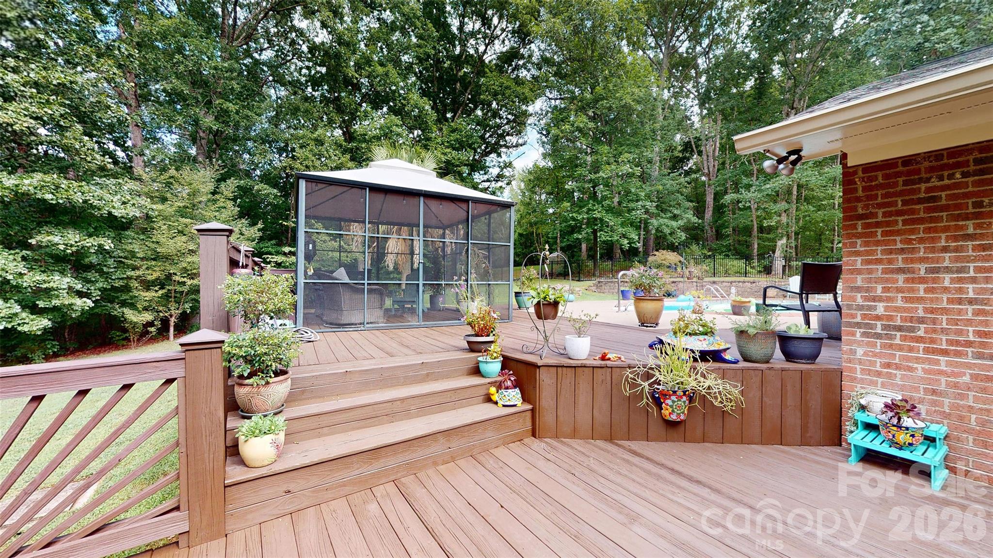 8720 Unionville-Brief Road Monroe, NC 28110 - Photo 30 of 35 a view of a patio with couches table and chairs and potted plants