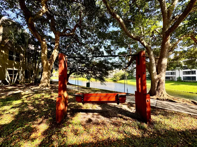 a swimming pool with outdoor seating and yard