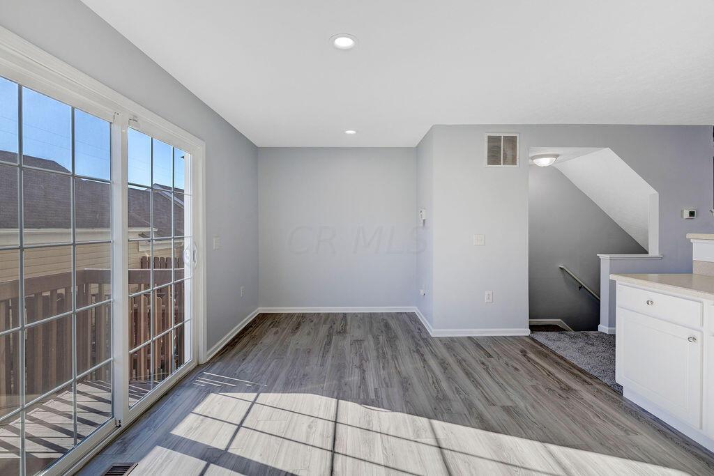 6345 Needletail Road, Unit 24634 Columbus, OH 43230 - Photo 12 of 58 • New luxury vinyl plank flooring ~ 2021 • Gray painted walls • Can lighting