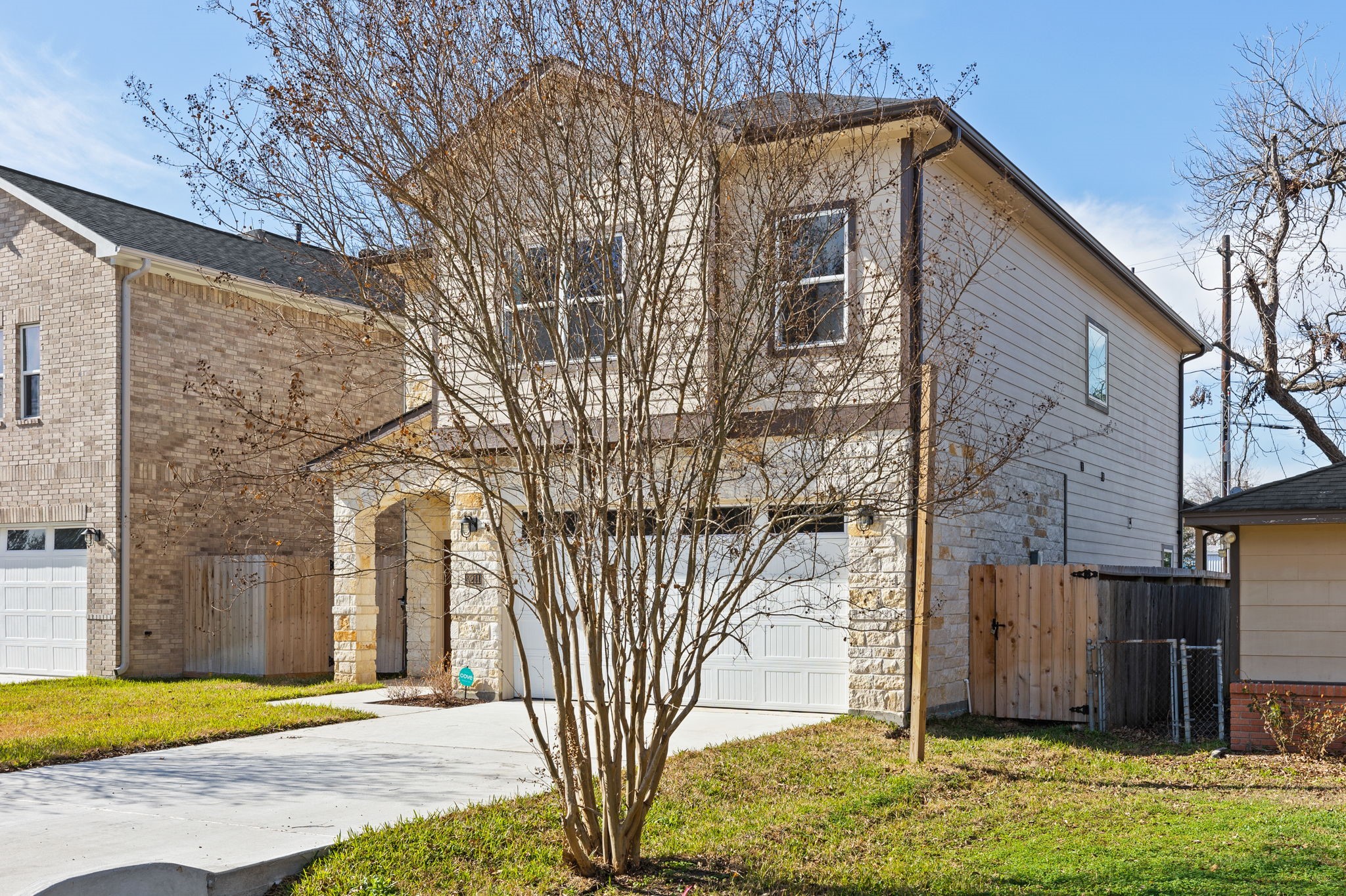 2211 Silverbonnet Street Houston, TX 77055 - Photo 2 of 39 a front view of a house with garden
