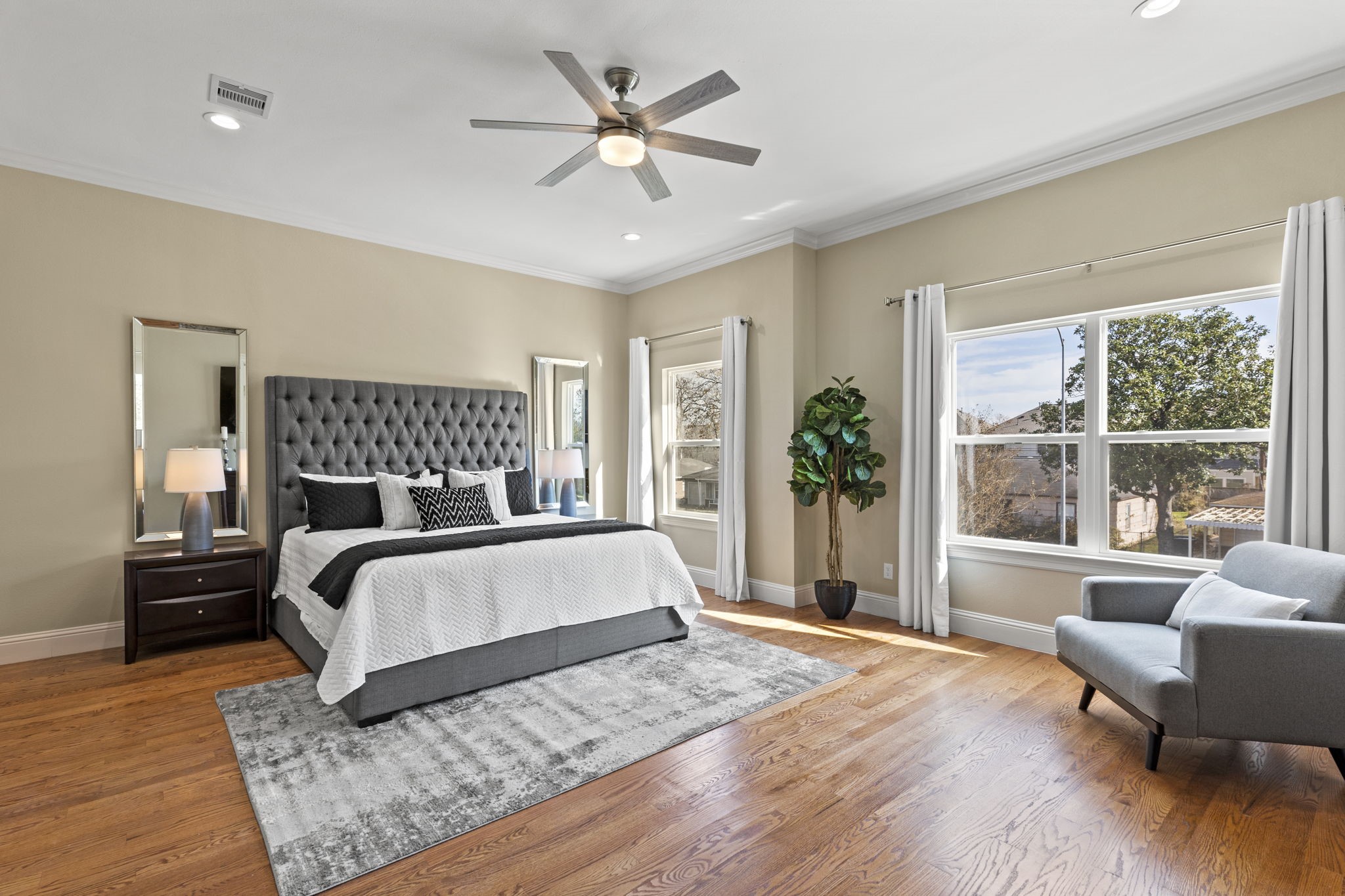 2211 Silverbonnet Street Houston, TX 77055 - Photo 24 of 39 a bedroom with a large bed and a large window