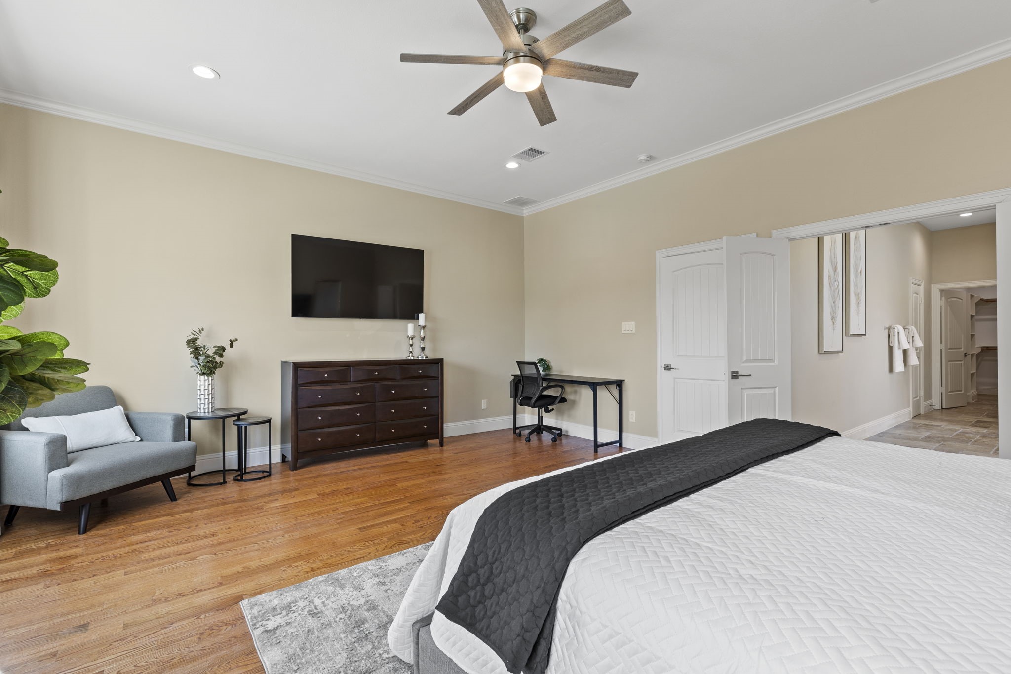 2211 Silverbonnet Street Houston, TX 77055 - Photo 26 of 39 a bedroom with a bed and a flat screen tv