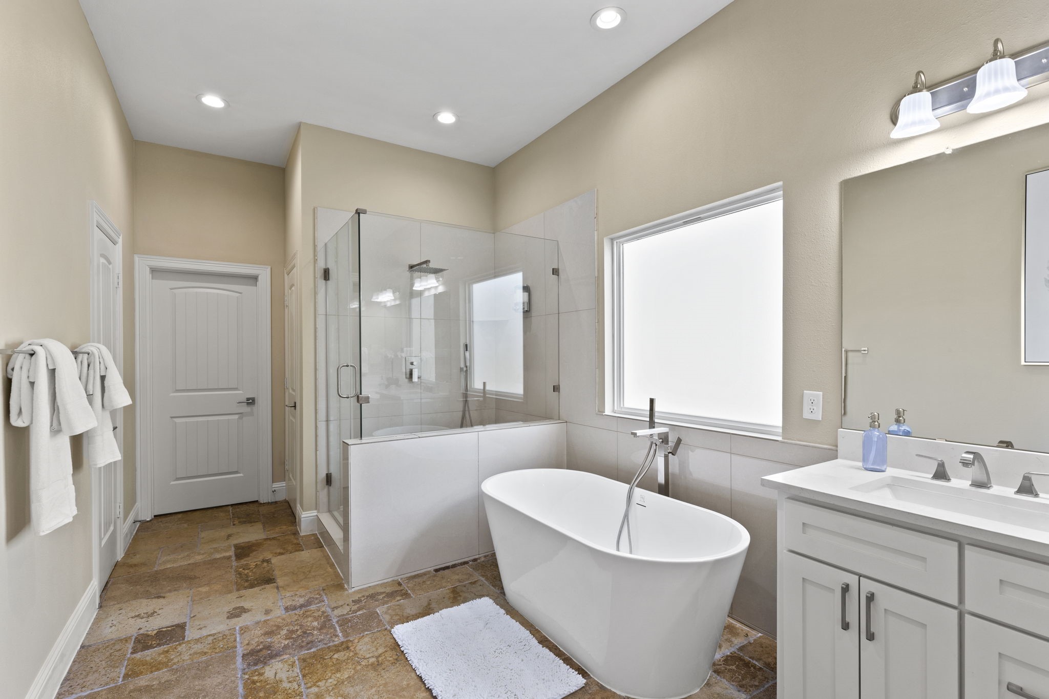 2211 Silverbonnet Street Houston, TX 77055 - Photo 29 of 39 a bathroom with a sink and a large mirror