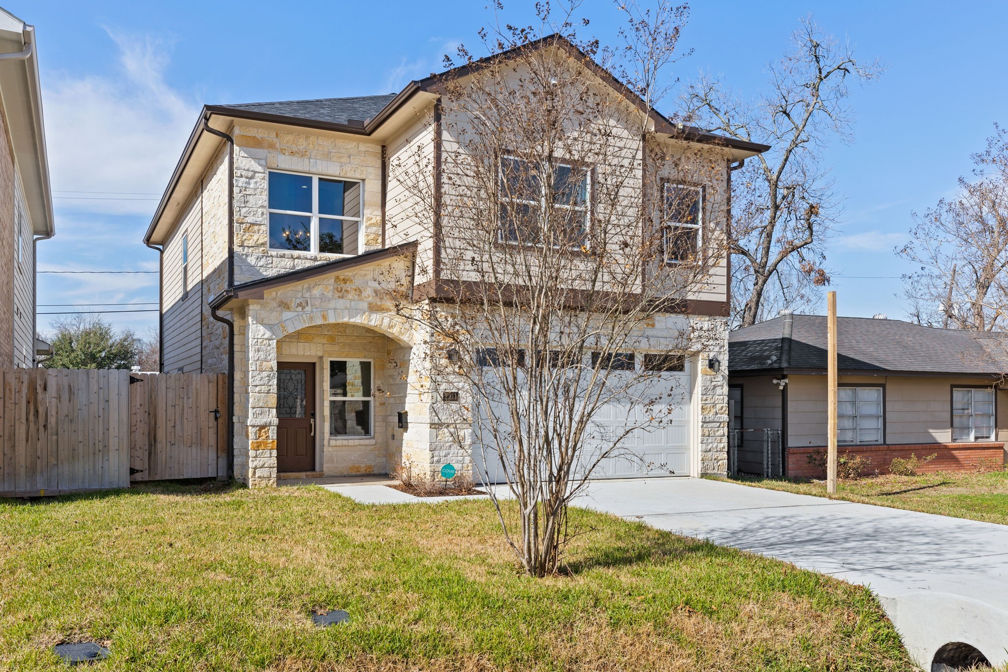 2211 Silverbonnet Street Houston, TX 77055 - Photo 3 of 39 a front view of a house with a yard