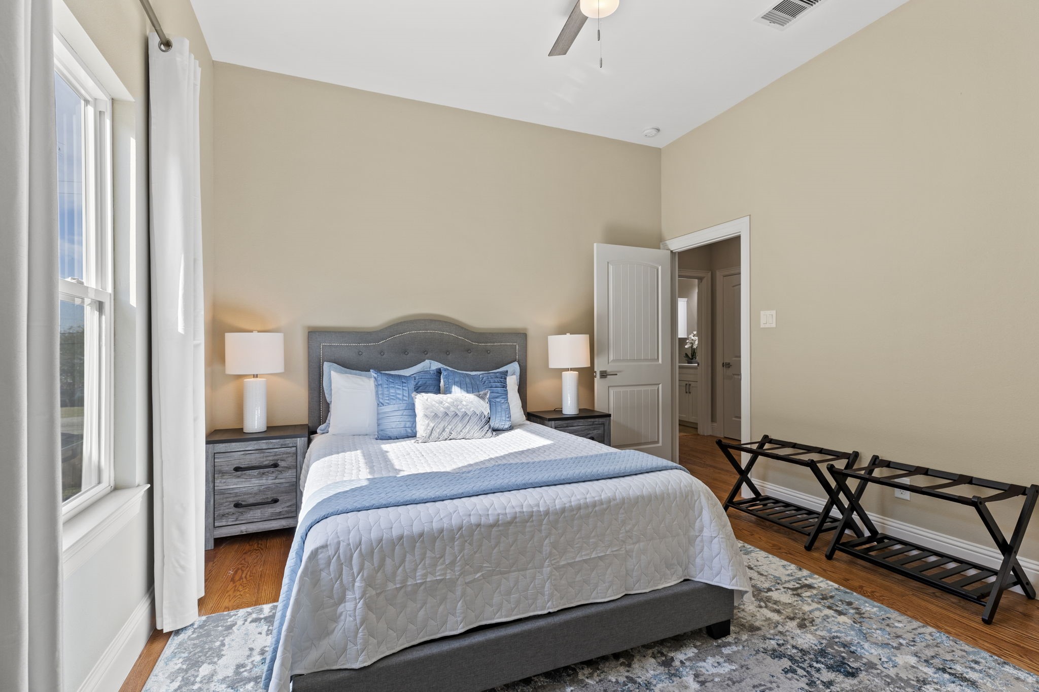 2211 Silverbonnet Street Houston, TX 77055 - Photo 35 of 39 a bedroom with a bed and wooden floor