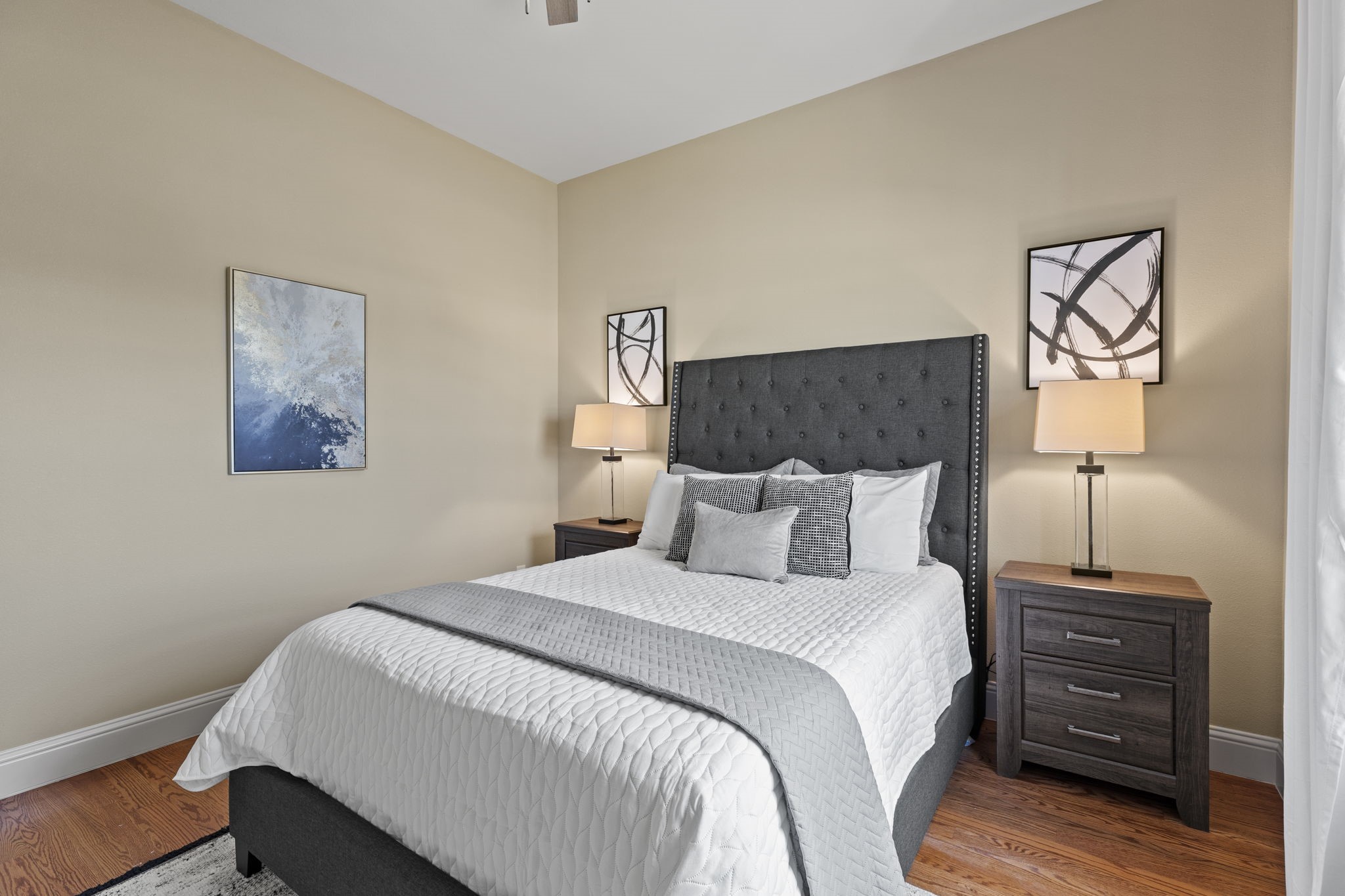 2211 Silverbonnet Street Houston, TX 77055 - Photo 37 of 39 a bedroom with a bed and a lamp on table