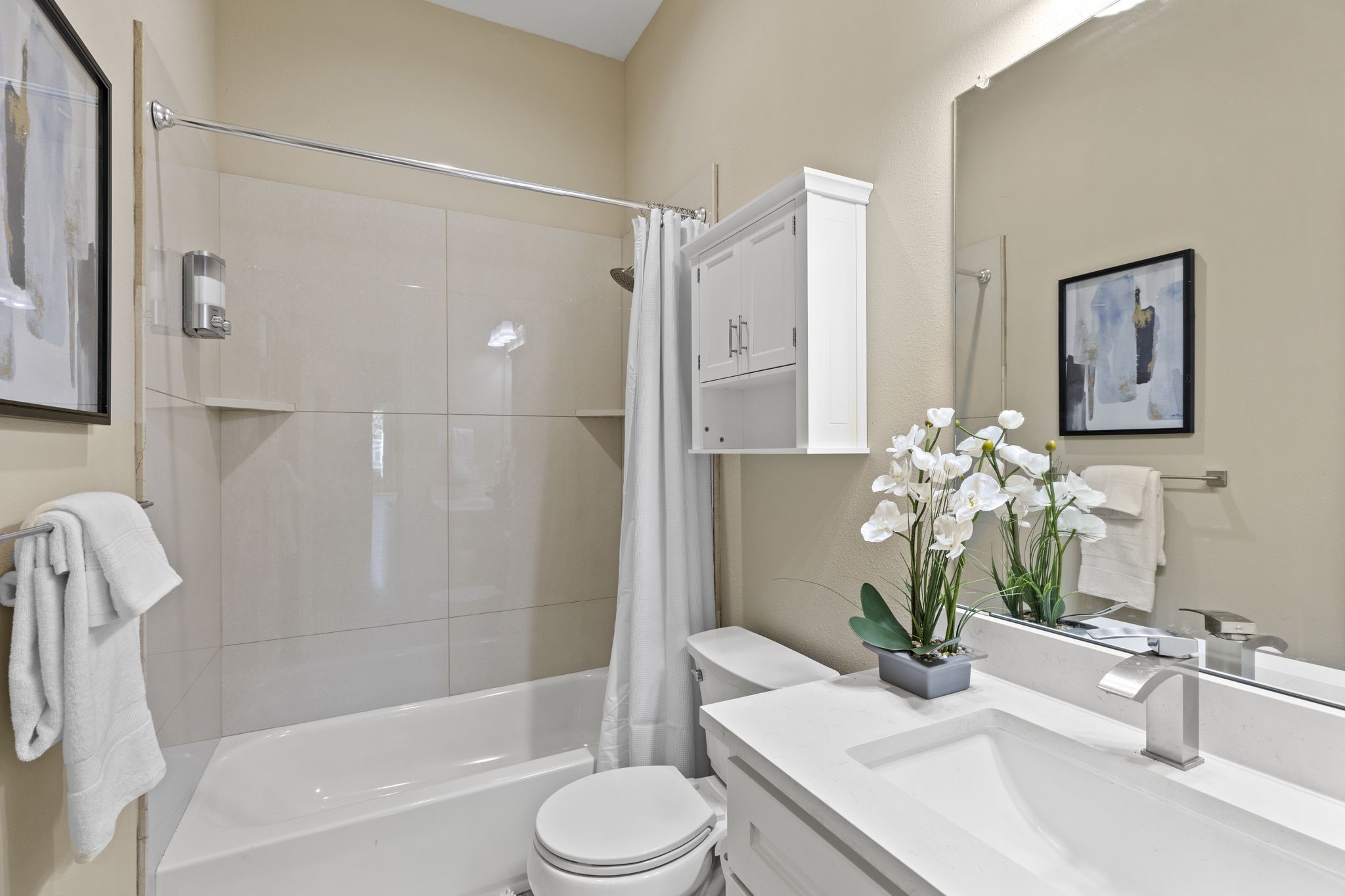 2211 Silverbonnet Street Houston, TX 77055 - Photo 38 of 39 a bathroom with a granite countertop sink a toilet and shower