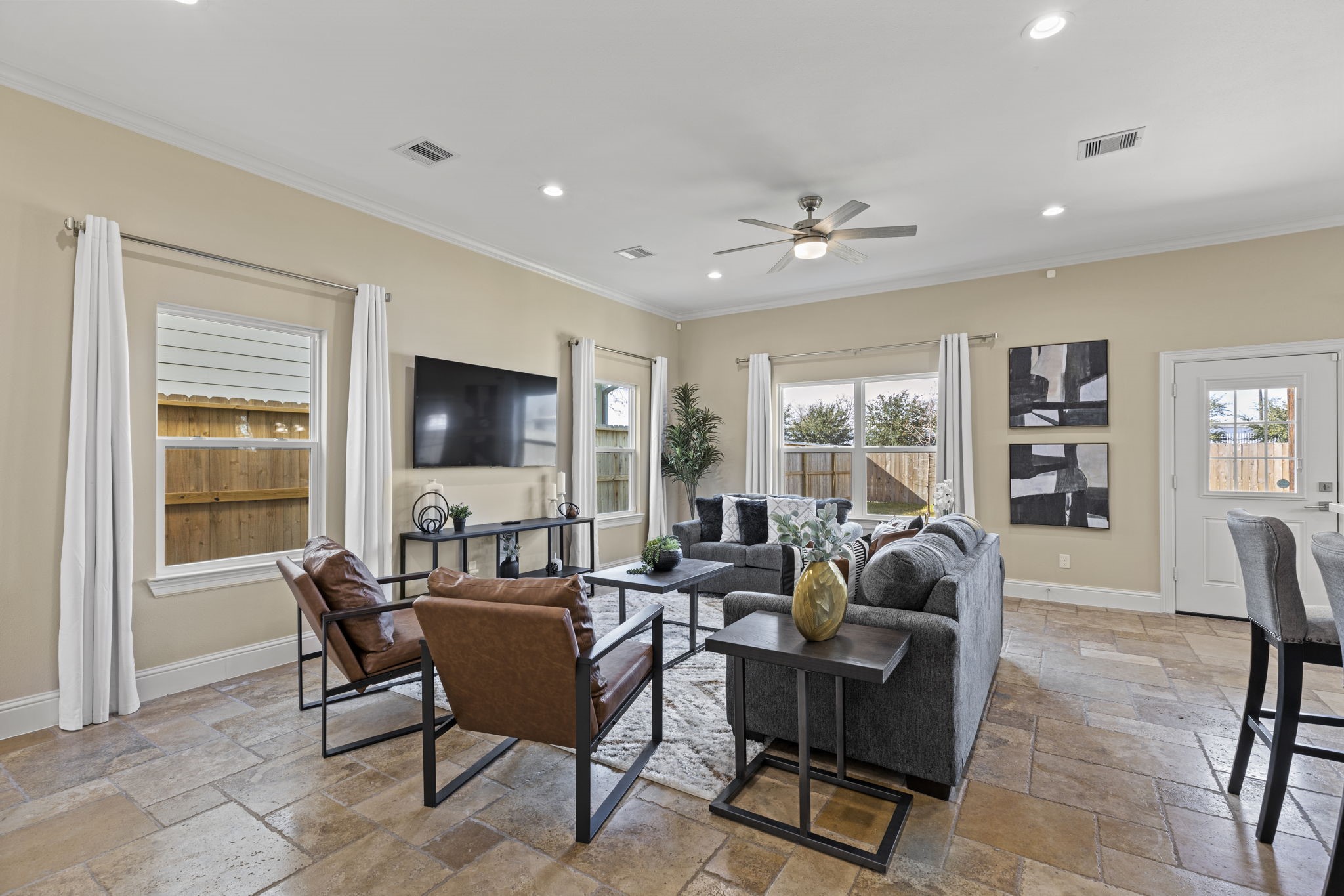 2211 Silverbonnet Street Houston, TX 77055 - Photo 9 of 39 a living room with furniture and a flat screen tv